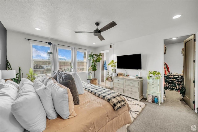 687 S Guy Ln Unit 1, Ivins, UT 84738 - bedroom with a textured ceiling, recessed lighting, a ceiling fan, a spacious closet, and light colored carpet