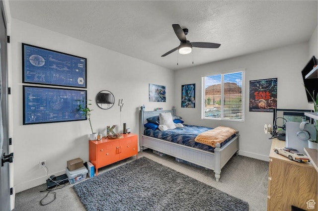687 S Guy Ln Unit 1, Ivins, UT 84738 - bedroom with baseboards, carpet flooring, a textured ceiling, and ceiling fan
