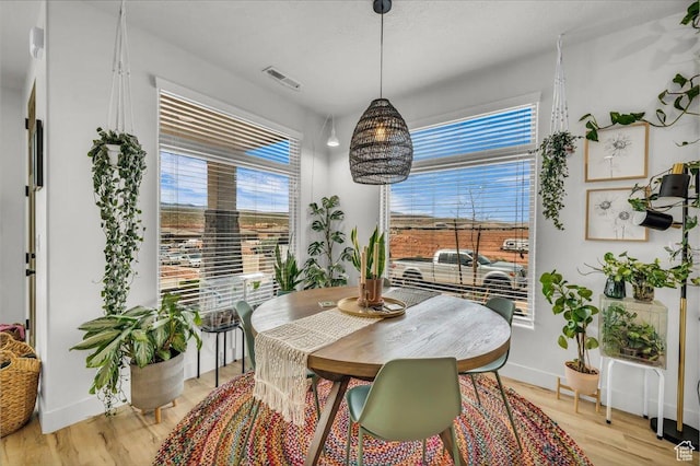 687 S Guy Ln Unit 1, Ivins, UT 84738 - dining area with light wood finished floors, baseboards, and visible vents