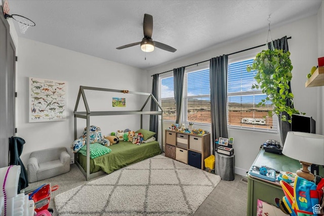 687 S Guy Ln Unit 1, Ivins, UT 84738 - carpeted bedroom featuring baseboards, ceiling fan, and a textured ceiling
