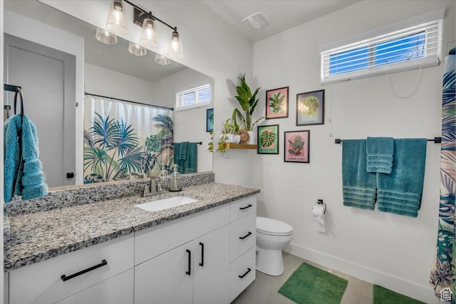 687 S Guy Ln Unit 1, Ivins, UT 84738 - bathroom with visible vents, baseboards, toilet, tile patterned floors, and vanity