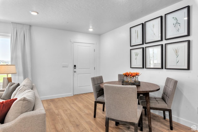 1596 S 3740 E Unit 1358, Spanish Fork, UT 84660 - dining area with baseboards, light wood-style floors, a textured ceiling, and recessed lighting