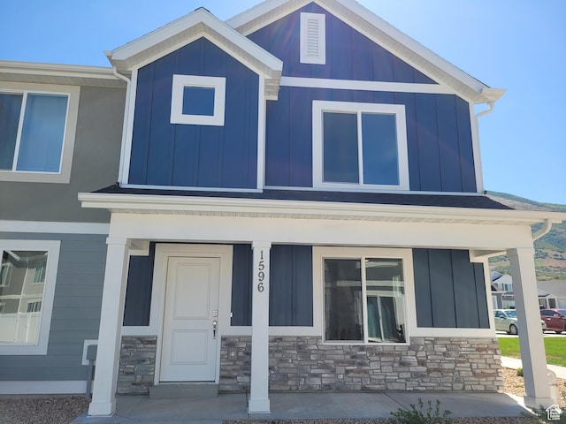 1596 S 3740 E Unit 1358, Spanish Fork, UT 84660 - view of front of house with covered porch, board and batten siding, and stone siding