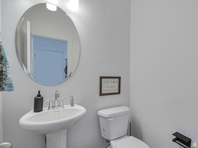 bathroom with a sink and toilet