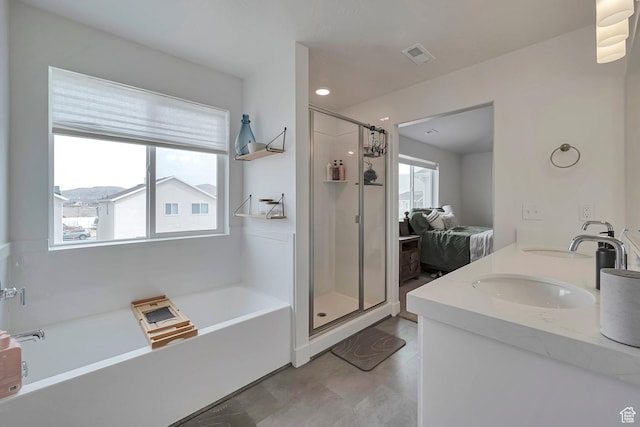 full bath with a bath, plenty of natural light, a shower stall, and visible vents