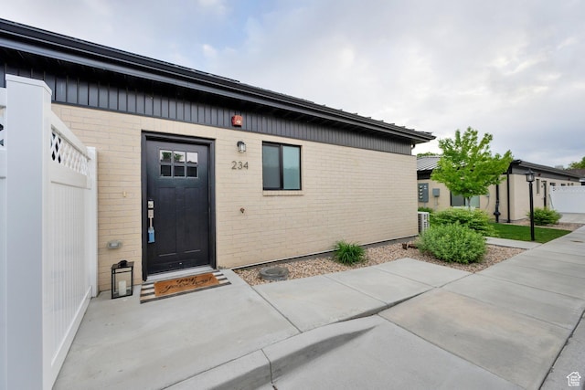 entrance to property with brick siding