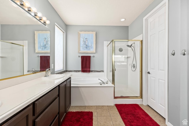 3352 E Sweetwater Springs Dr, Washington, UT 84780 - full bath featuring a garden tub, vanity, tile patterned floors, and a shower stall