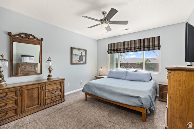 3352 E Sweetwater Springs Dr, Washington, UT 84780 - bedroom featuring baseboards, ceiling fan, visible vents, and light carpet