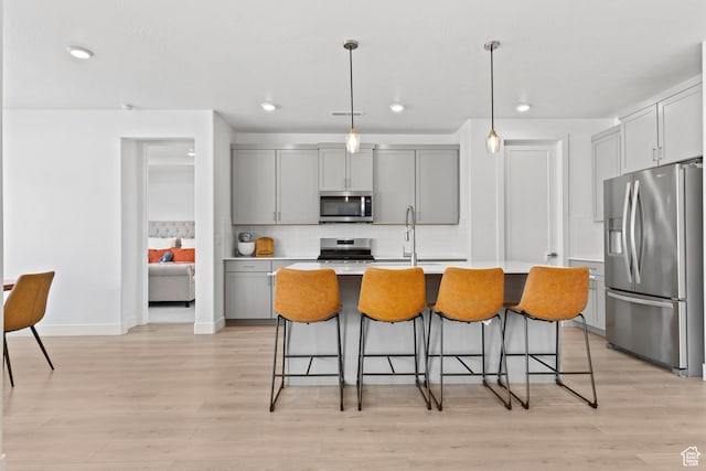 698 W Cypress Umber Dr, St George, UT 84790 - kitchen featuring gray cabinets, backsplash, and stainless steel appliances