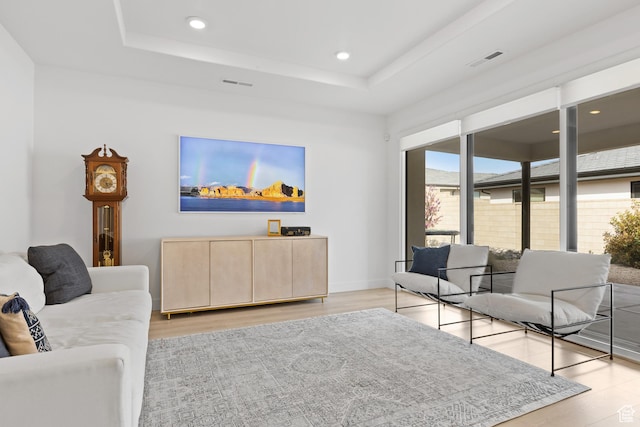 698 W Cypress Umber Dr, St George, UT 84790 - living area featuring a tray ceiling, recessed lighting, baseboards, light wood finished floors, and visible vents