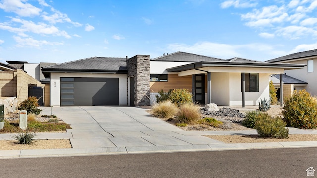 698 W Cypress Umber Dr, St George, UT 84790 - prairie-style house with driveway, stucco siding, and an attached garage
