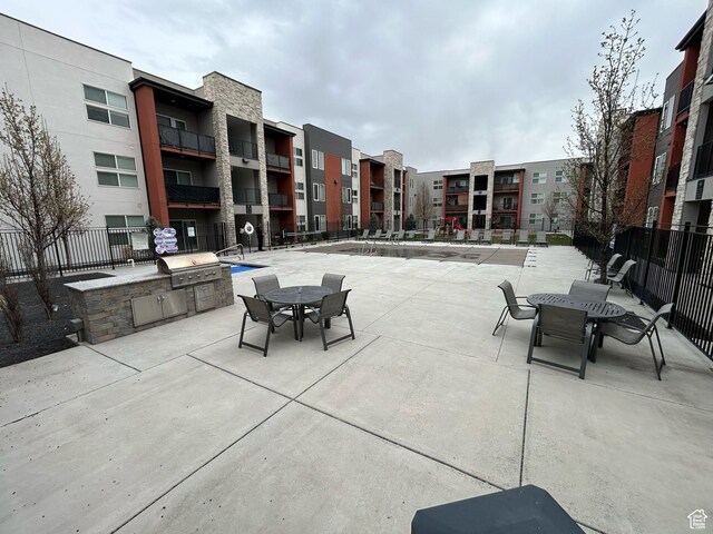 875 S Depot St E Unit C307, Clearfield, UT 84015 - view of patio featuring fence, an outdoor kitchen, and area for grilling