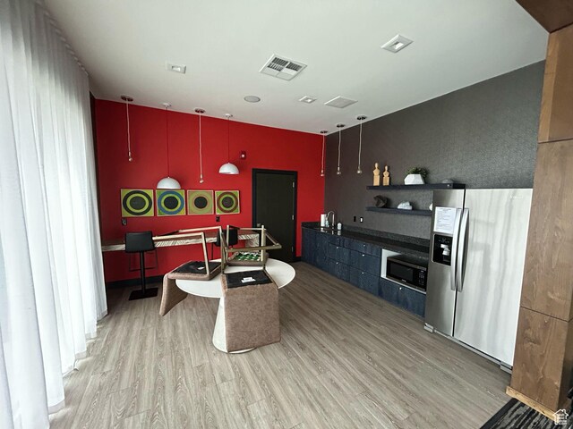 875 S Depot St E Unit C307, Clearfield, UT 84015 - kitchen with visible vents, stainless steel appliances, open shelves, and wood finished floors