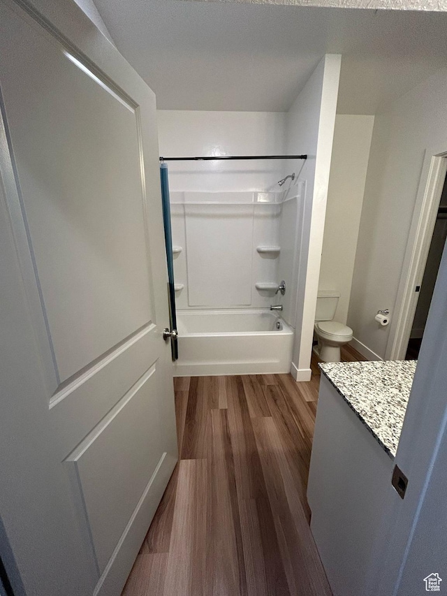 875 S Depot St E Unit C307, Clearfield, UT 84015 - full bathroom with vanity, toilet, baseboards,  shower combination, and wood finished floors