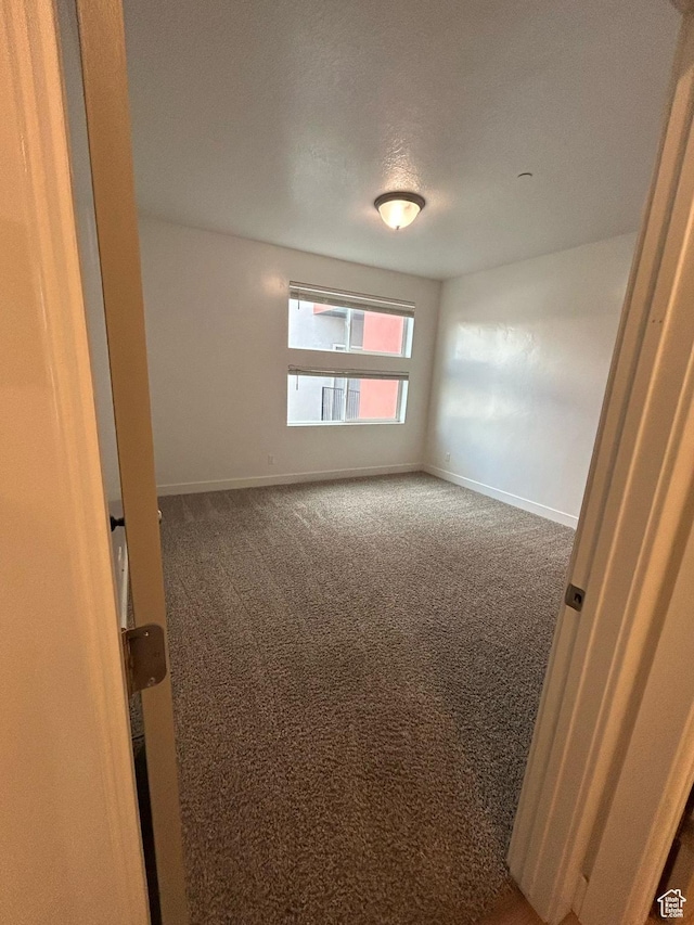 875 S Depot St E Unit C307, Clearfield, UT 84015 - spare room with baseboards and carpet floors