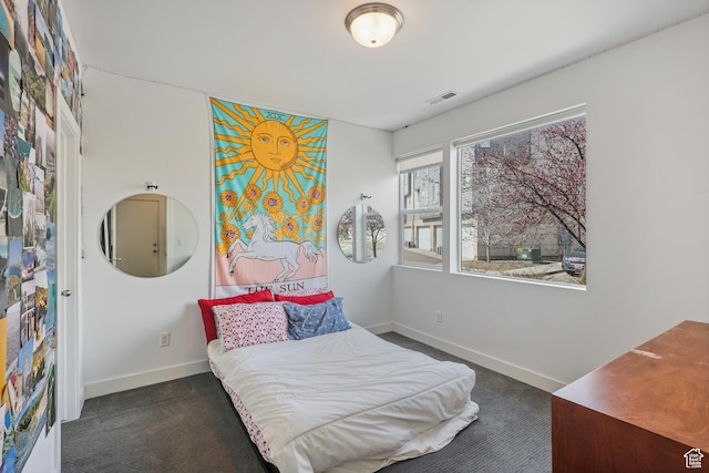 1051 W Rooftop Dr S Unit 401, Midvale, UT 84047 - bedroom with carpet, baseboards, and visible vents