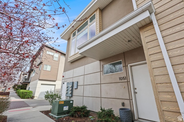 1051 W Rooftop Dr S Unit 401, Midvale, UT 84047 - view of home's exterior with stucco siding