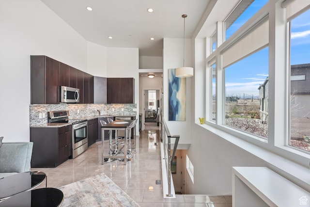 1051 W Rooftop Dr S Unit 401, Midvale, UT 84047 - kitchen featuring modern cabinets, appliances with stainless steel finishes, and dark brown cabinets