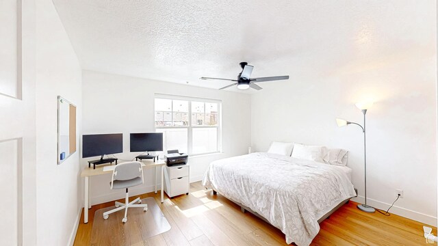 2527 W 500 S Unit 1, Springville, UT 84663 - bedroom with baseboards, a ceiling fan, wood finished floors, and a textured ceiling