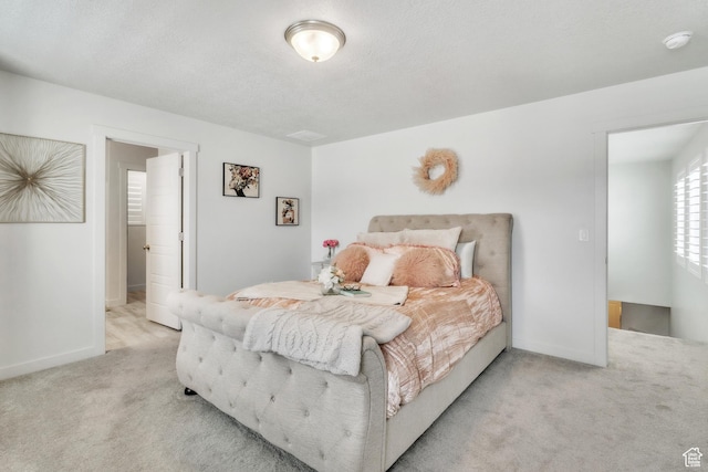 1710 S Prevedel Dr, West Haven, UT 84401 - carpeted bedroom featuring baseboards and a textured ceiling