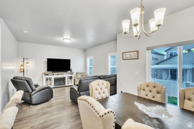 1710 S Prevedel Dr, West Haven, UT 84401 - dining area with light wood-style floors and a notable chandelier