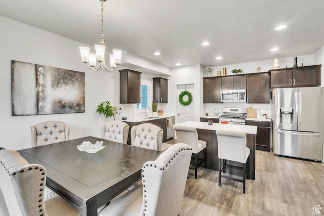 1710 S Prevedel Dr, West Haven, UT 84401 - dining area featuring an inviting chandelier, light wood-style flooring, and recessed lighting