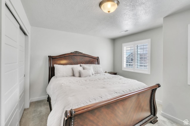 1710 S Prevedel Dr, West Haven, UT 84401 - bedroom featuring light carpet, baseboards, visible vents, and a closet