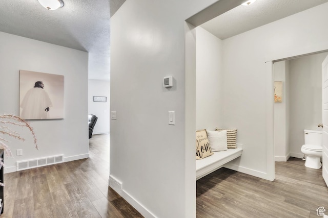 1710 S Prevedel Dr, West Haven, UT 84401 - hallway with baseboards, visible vents, wood finished floors, and a textured ceiling