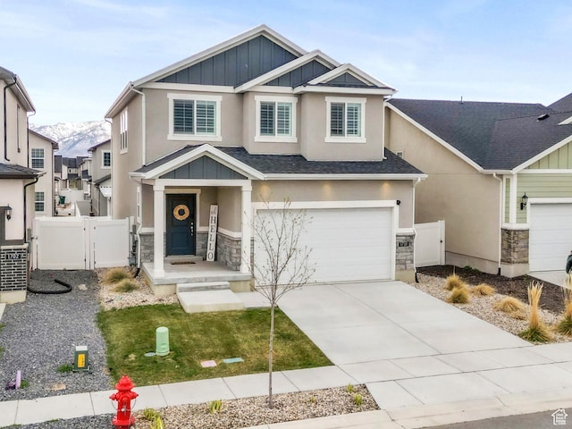 1710 S Prevedel Dr, West Haven, UT 84401 - craftsman-style house with stone siding, a gate, a garage, and fence