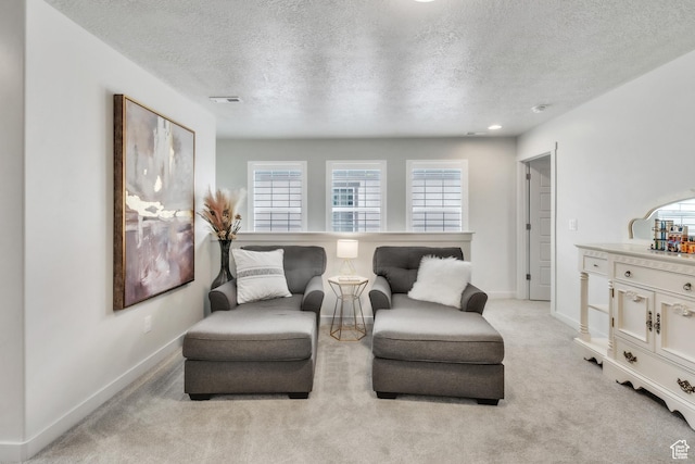 1710 S Prevedel Dr, West Haven, UT 84401 - sitting room with a textured ceiling, baseboards, light colored carpet, and visible vents