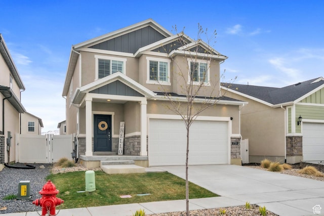 1710 S Prevedel Dr, West Haven, UT 84401 - craftsman house with concrete driveway, stucco siding, an attached garage, stone siding, and a gate