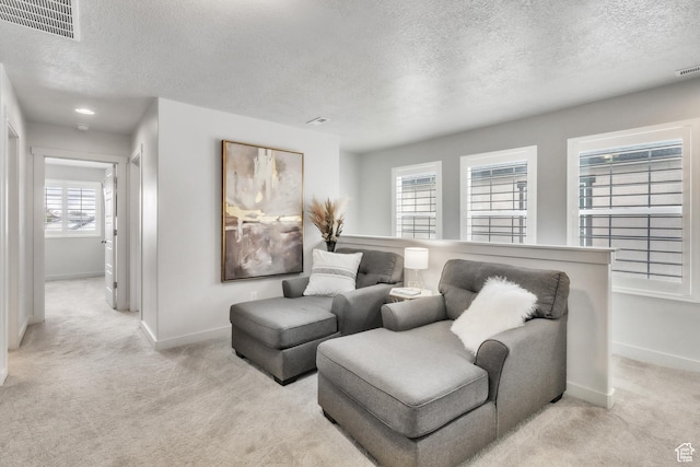 1710 S Prevedel Dr, West Haven, UT 84401 - living area featuring baseboards, visible vents, and light carpet