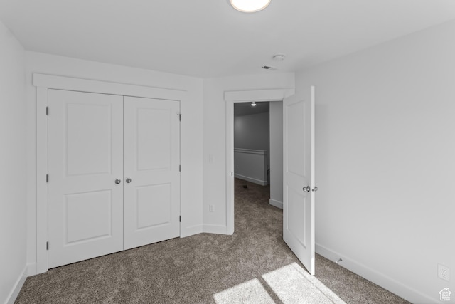 3175 S 204 W, Nibley, UT 84321 - unfurnished bedroom featuring baseboards, a closet, and carpet flooring