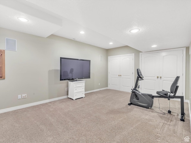 workout room featuring carpet floors, recessed lighting, and baseboards