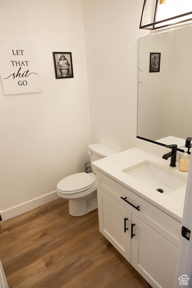 686 N 275 W Unit 1, La Verkin, UT 84745 - half bathroom with toilet, wood finished floors, baseboards, and vanity