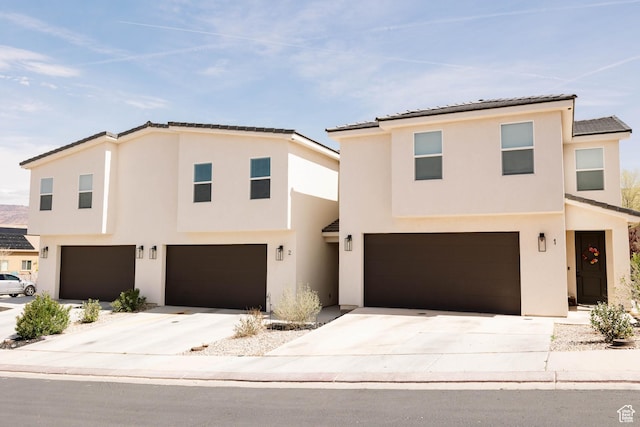 686 N 275 W Unit 1, La Verkin, UT 84745 - view of front of house with driveway, stucco siding, and an attached garage