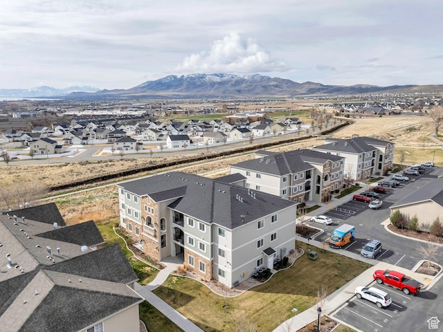 aerial perspective of suburban area featuring a mountain backdrop
