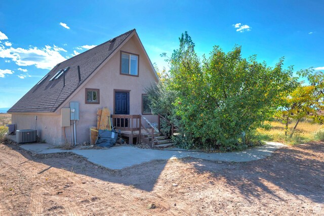20161 W 5000 S, Duchesne, UT 84021 - rear view of property with central AC unit, stucco siding, and roof with shingles