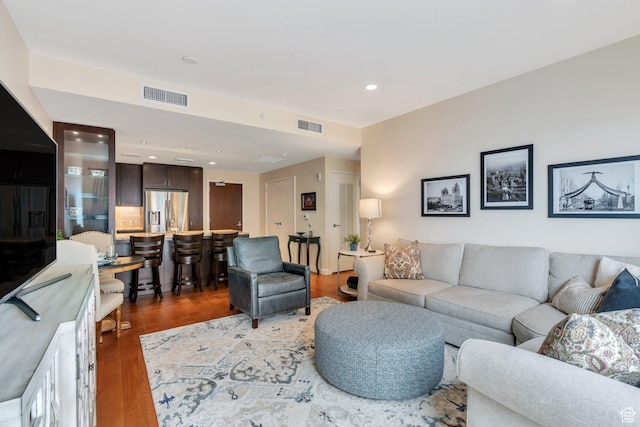 45 W S Temple Unit 603, Salt Lake City, UT 84101 - living room featuring visible vents, wood finished floors, and recessed lighting
