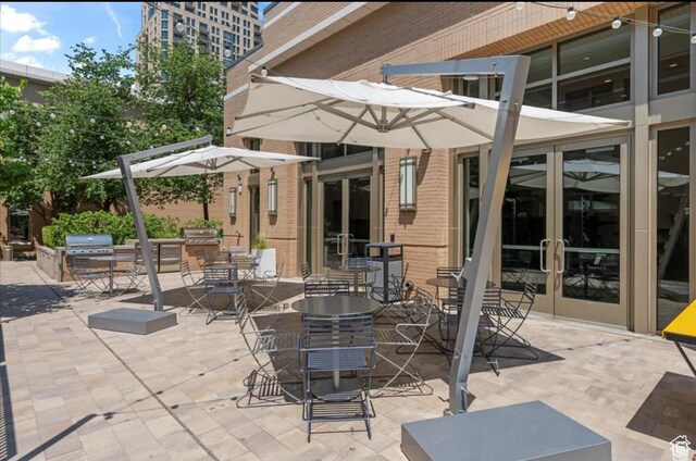 45 W S Temple Unit 603, Salt Lake City, UT 84101 - view of patio with a grill, area for grilling, and french doors