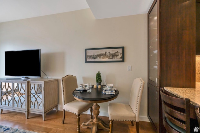 45 W S Temple Unit 603, Salt Lake City, UT 84101 - dining room with baseboards and wood finished floors