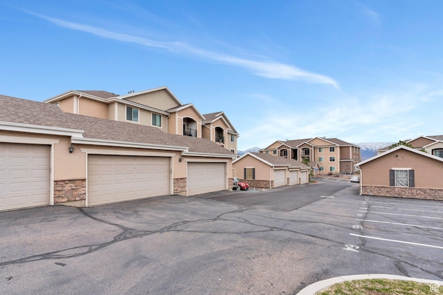 view of asphalt road with a residential view