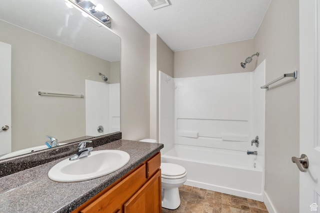 bathroom featuring toilet, shower / washtub combination, vanity, and baseboards