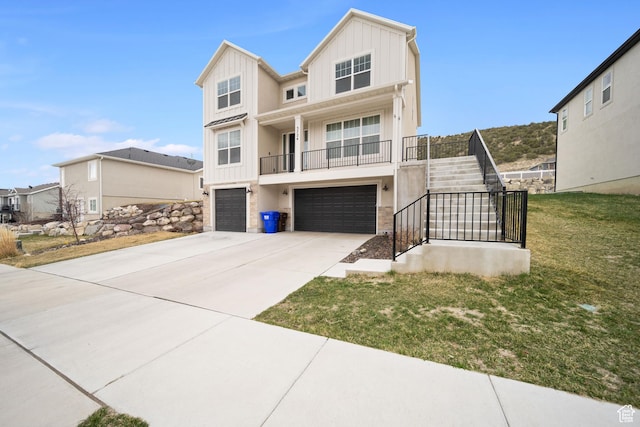 3724 E Long Ridge Dr, Eagle Mountain, UT 84005 - view of front of home with driveway, stairs, a garage, and board and batten siding