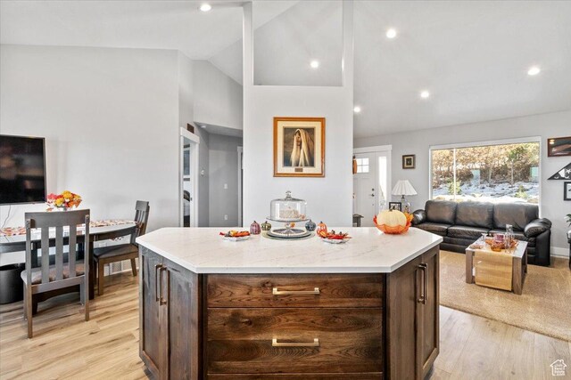 14440 N 11740 E, Mount Pleasant, UT 84647 - kitchen with open floor plan, vaulted ceiling, healthy amount of natural light, light wood finished floors, and a kitchen island