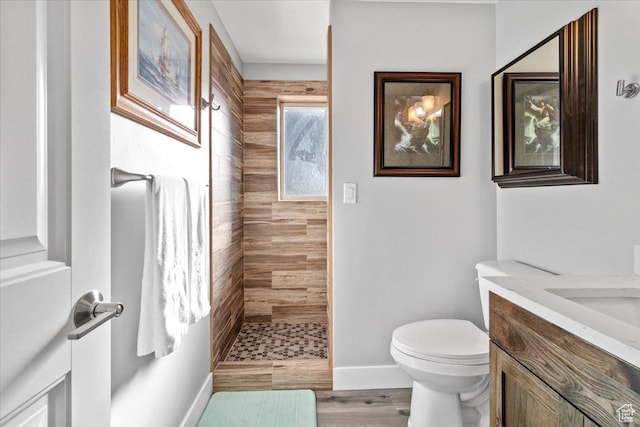 14440 N 11740 E, Mount Pleasant, UT 84647 - full bathroom with a tile shower, vanity, toilet, baseboards, and wood finished floors