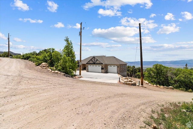 14440 N 11740 E, Mount Pleasant, UT 84647 - view of front facade featuring concrete driveway and an attached garage