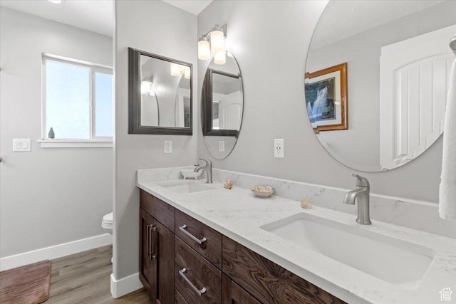 14440 N 11740 E, Mount Pleasant, UT 84647 - full bath with toilet, double vanity, baseboards, and wood finished floors