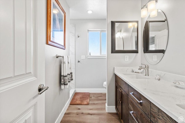 14440 N 11740 E, Mount Pleasant, UT 84647 - full bath featuring double vanity, wood finished floors, a shower, baseboards, and toilet