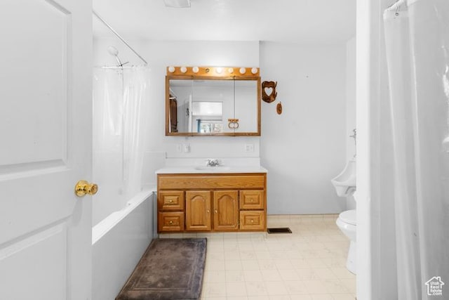 full bath with toilet, shower / tub combo, and vanity